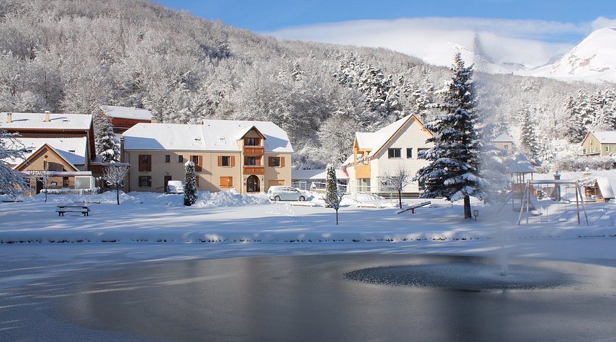 The La Neyrette grounds and lake under snow